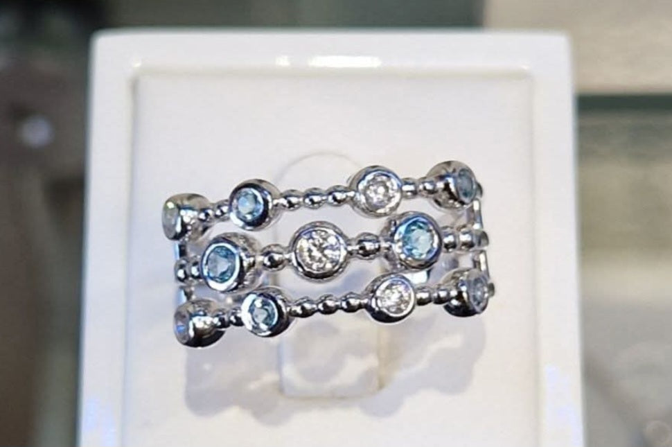 Modern three-row design Blue Topaz and CZ Ring